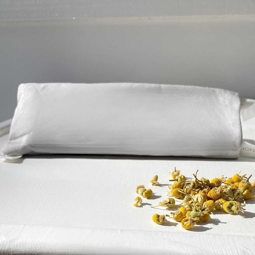soothing eye pillow with chamomile flowers